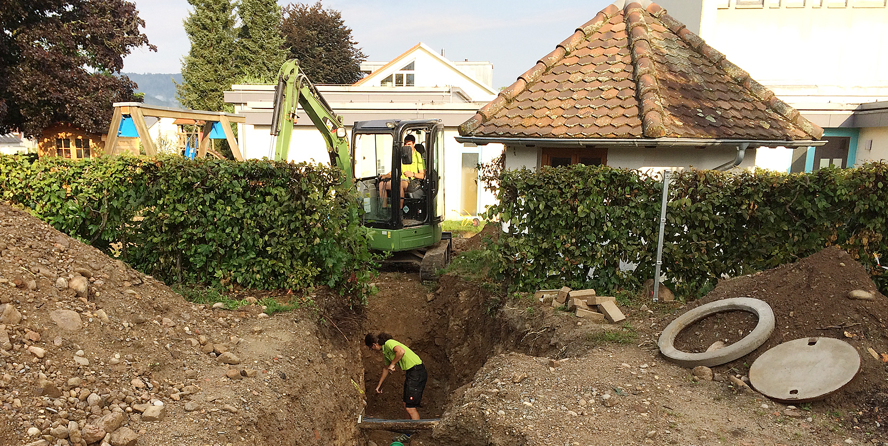 Kiga: Regenwassersanierung und Zaun